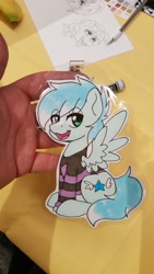 Size: 1152x2048 | Tagged: safe, artist:inkkeystudios, oc, oc only, pegasus, pony, badge, clothes, lidded eyes, looking at you, open mouth, open smile, photo, shirt, sitting, smiling, solo, spread wings, traditional art, wings