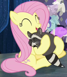 Size: 446x514 | Tagged: safe, screencap, fluttershy, softpad, pegasus, pony, raccoon, fake it 'til you make it, g4, season 8, cropped, cute, eyes closed, female, happy, hnnng, hug, mare, shyabetes