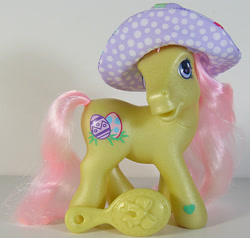 Size: 631x600 | Tagged: safe, photographer:breyer600, toodleloo, pony, g3, brushable, comb, hat, hoof heart, irl, photo, solo, toy, underhoof