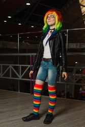 Size: 720x1080 | Tagged: safe, artist:helen the witch, rainbow dash, human, rubronycon, g4, choker, clothes, cosplay, costume, female, glasses, grin, irl, irl human, jacket, leather, leather jacket, looking at you, photo, rainbow socks, shoes, smiling, socks, solo, standing, striped socks