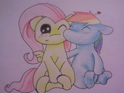 Size: 640x480 | Tagged: safe, artist:fluttersdoodles, fluttershy, rainbow dash, pegasus, pony, g4, blushing, cheek kiss, duo, eyes closed, female, folded wings, kissing, lesbian, one eye closed, open mouth, ship:flutterdash, shipping, sitting, surprised, traditional art, wings, wink