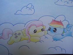 Size: 640x480 | Tagged: safe, artist:fluttersdoodles, fluttershy, rainbow dash, pegasus, pony, g4, cloud, duo, female, holding hooves, lesbian, looking at each other, looking at someone, lying down, lying on a cloud, on a cloud, ship:flutterdash, shipping, sky, traditional art