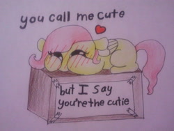 Size: 640x480 | Tagged: safe, artist:fluttersdoodles, fluttershy, pegasus, pony, g4, blushing, box, cute, female, heart, hooves on face, lying down, paper, shyabetes, solo, traditional art