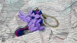 Size: 1280x720 | Tagged: safe, artist:made_by_franch, twilight sparkle, alicorn, pony, g1, g4, book, craft, figure, floppy ears, handmade, keychain, read, solo, trinket, twilight sparkle (alicorn)