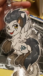 Size: 5312x2988 | Tagged: safe, artist:inkkeystudios, oc, oc only, pegasus, pony, :3, badge, clothes, freckles, lidded eyes, looking at you, open mouth, open smile, paper pony, paw socks, photo, smiling, socks, solo, spread wings, traditional art, wings