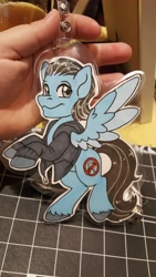 Size: 5312x2988 | Tagged: safe, artist:inkkeystudios, pegasus, pony, badge, clothes, colored wings, colored wingtips, jacket, looking at you, photo, smiling, solo, spread wings, traditional art, two toned wings, wings