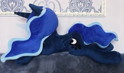 Size: 2048x1213 | Tagged: safe, artist:mdcraft10, princess luna, alicorn, pony, g4, female, folded wings, horn, irl, lying down, mare, photo, plushie, prone, safe. solo, wings