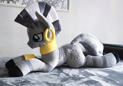 Size: 2048x1428 | Tagged: safe, artist:mdcraft10, zecora, zebra, g4, bed, ear piercing, earring, female, indoors, irl, jewelry, lying down, lying on bed, mare, on bed, photo, piercing, plushie, prone, solo