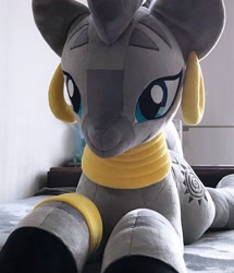 Size: 1762x2048 | Tagged: safe, artist:mdcraft10, zecora, zebra, g4, ear piercing, earring, female, indoors, irl, jewelry, lying down, mare, photo, piercing, plushie, prone, solo