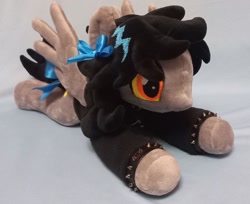Size: 1276x1042 | Tagged: safe, artist:covariate, oc, oc only, oc:lightning dee, pegasus, pony, bow, choker, clothes, commission, female, hoodie, irl, long sleeves, lying down, mare, photo, plushie, prone, solo, spiked choker, spiked wristband, spread wings, tail, tail bow, wings, wristband