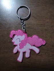 Size: 972x1296 | Tagged: safe, derpibooru exclusive, pinkie pie, earth pony, pony, g4, eyes closed, female, irl, keychain, mare, merchandise, photo, smiling, solo