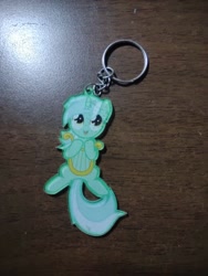 Size: 972x1296 | Tagged: safe, lyra heartstrings, pony, unicorn, g4, female, horn, irl, keychain, lyre, mare, merchandise, musical instrument, photo, solo