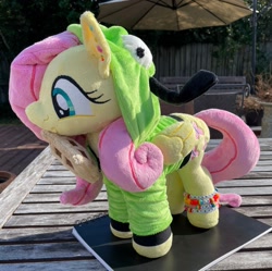 Size: 2048x2036 | Tagged: safe, artist:orky, fluttershy, pegasus, pony, antonymph, cutiemarks (and the things that bind us), vylet pony, g4, clothes, ear piercing, earring, female, fluttgirshy, folded wings, food, gir, happy, high res, hood up, hoodie, invader zim, irl, jewelry, mare, photo, piercing, plushie, solo, standing, waffle, wings