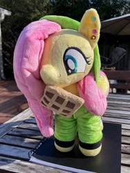 Size: 1536x2048 | Tagged: safe, artist:orky, fluttershy, pegasus, pony, antonymph, cutiemarks (and the things that bind us), vylet pony, g4, clothes, ear piercing, earring, female, fluttgirshy, folded wings, food, gir, happy, hood up, hoodie, invader zim, irl, jewelry, mare, photo, piercing, plushie, solo, standing, waffle, wings