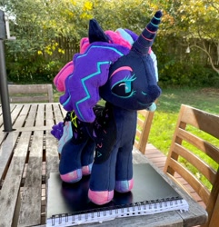 Size: 1977x2048 | Tagged: safe, artist:orky, oc, oc only, pony, unicorn, commission, female, irl, leonine tail, lidded eyes, mare, outdoors, photo, plushie, solo, standing, tail