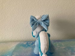 Size: 1280x960 | Tagged: safe, artist:melodisde, oc, oc:snowdrop, pegasus, pony, blind, bow, commission, female, filly, foal, folded wings, happy, irl, photo, plushie, smiling, solo, standing, wings