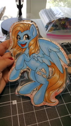 Size: 5312x2988 | Tagged: safe, artist:inkkeystudios, oc, oc only, pegasus, pony, badge, happy, looking at you, open mouth, open smile, photo, smiling, solo, spread wings, traditional art, wings