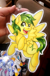 Size: 677x1025 | Tagged: safe, artist:inkkeystudios, oc, oc only, pegasus, pony, badge, eye clipping through hair, flying, looking at you, open mouth, open smile, photo, smiling, solo, spread wings, traditional art, wings