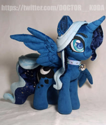 Size: 1920x2261 | Tagged: safe, artist:doctorkoda, princess luna, alicorn, pony, g4, alternate design, bell, collar, female, horn, irl, mare, photo, plushie, solo, spread wings, standing, wings