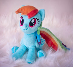 Size: 1053x962 | Tagged: safe, artist:buttercupbabyppg, rainbow dash, pegasus, pony, g4, female, folded wings, irl, mare, photo, plushie, sitting, smiling, solo, wings