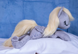 Size: 1415x990 | Tagged: safe, artist:buttercupbabyppg, derpy hooves, pegasus, pony, g4, eyes closed, female, folded wings, happy, irl, lying down, mare, photo, plushie, prone, sleeping, wings