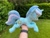 Size: 2048x1536 | Tagged: safe, artist:rtryart, lyra heartstrings, pony, unicorn, g4, female, happy, horn, irl, lying down, mare, outdoors, photo, plushie, prone, smiling, solo