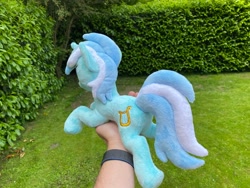 Size: 2048x1536 | Tagged: safe, artist:rtryart, lyra heartstrings, pony, unicorn, g4, female, happy, horn, irl, lying down, mare, outdoors, photo, plushie, prone, smiling, solo