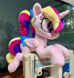 Size: 1944x2048 | Tagged: safe, artist:rtryart, princess cadance, alicorn, pony, g4, bow, female, folded wings, horn, irl, lying down, mare, photo, plushie, prone, solo, teen princess cadance, wings