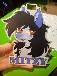 Size: 1536x2048 | Tagged: safe, artist:crimmharmony, oc, oc only, oc:mitzy, bat pony, pony, badge, bust, chest fluff, eye clipping through hair, eyebrows, eyebrows visible through hair, freckles, lidded eyes, looking at you, photo, solo