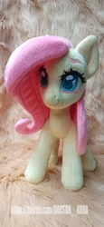 Size: 1890x4096 | Tagged: safe, artist:doctorkoda, fluttershy, pegasus, pony, g4, female, folded wings, irl, mare, photo, plushie, smiling, solo, standing, wings