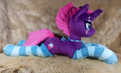 Size: 4096x2458 | Tagged: safe, artist:doctorkoda, tempest shadow, pony, unicorn, g4, bell, broken horn, clothes, collar, female, horn, irl, lying down, mare, photo, plushie, prone, scar, socks, solo, striped socks