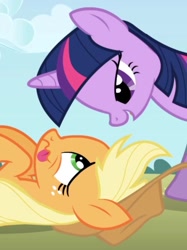 Size: 631x842 | Tagged: safe, screencap, applejack, twilight sparkle, earth pony, pony, unicorn, applebuck season, g4, season 1, cropped, exhausted, eye contact, lidded eyes, looking at each other, looking at someone, lying down, on back, out of context, smiling, tired, unicorn twilight