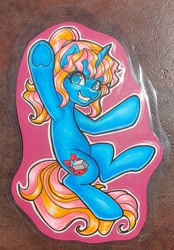 Size: 2108x3032 | Tagged: safe, artist:inkkeystudios, pony, unicorn, badge, eye clipping through hair, grin, high res, looking at you, photo, smiling, solo, traditional art, underhoof