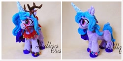 Size: 1920x960 | Tagged: safe, artist:hellgacraft, izzy moonbow, deer, pony, reindeer, unicorn, g5, antlers, bell, bracelet, colored hooves, female, happy, irl, jewelry, mare, photo, plushie, solo, standing, tack