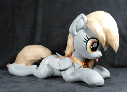 Size: 3048x2212 | Tagged: safe, artist:doctorkoda, derpy hooves, pegasus, pony, g4, :p, female, folded wings, high res, irl, lying down, mare, photo, plushie, prone, solo, tongue out, wings