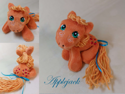 Size: 1280x961 | Tagged: safe, artist:starfulstitches, applejack (g1), earth pony, pony, g1, female, irl, lying down, mare, photo, plushie, prone, solo