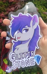 Size: 2232x3480 | Tagged: safe, alternate version, artist:autumnsfur, oc, oc only, oc:glitter stone, earth pony, human, pony, g4, g5, badge, bust, con badge, diamond, digital art, eyelashes, eyeshadow, female, gray coat, gray fur, happy, high res, irl, irl human, lanyard, long hair, long mane, looking at something, looking sideways, makeup, mare, name, open mouth, outline, photo, portrait, purple eyes, purple hair, purple mane, simple background, smiling, solo, text, tongue out, white outline