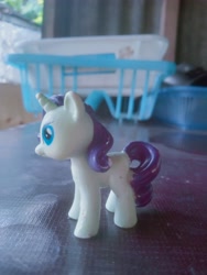 Size: 3072x4096 | Tagged: safe, rarity, pony, unicorn, curly mane, high res, horn, irl, photo, purple mane, shutterstock, table, toy