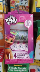 Size: 4000x2250 | Tagged: safe, izzy moonbow, pipp petals, sunny starscout, pegasus, pony, unicorn, g5, dollar tree, family dollar, irl, looking at you, merchandise, my little pony logo, photo, sticker set, tongue out