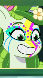 Size: 606x1080 | Tagged: safe, screencap, leaf pony, pony, unicorn, diva and conquer, g5, my little pony: tell your tale, spoiler:g5, spoiler:my little pony: tell your tale, spoiler:tyts01e56, face paint, female, flower, flower in hair, grin, lightning, mare, smiling, solo, youtube shorts