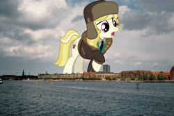 Size: 1536x1024 | Tagged: safe, anonymous editor, artist:starryshineviolet, edit, march gustysnows, earth pony, pony, g4, clothes, copenhagen, denmark, female, giant pony, giantess, hat, highrise ponies, irl, macro, mare, photo, ponies in real life, raised hoof, solo, ushanka