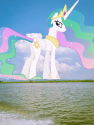 Size: 1440x1920 | Tagged: safe, anonymous editor, artist:90sigma, edit, princess celestia, alicorn, pony, g4, crown, female, folded wings, giant pony, giantess, giantlestia, highrise ponies, hoof shoes, irl, jewelry, looking at you, looking back, looking back at you, macro, mare, mountain, mountain range, peytral, photo, ponies in real life, regalia, scenery, smiling, solo, water, wings