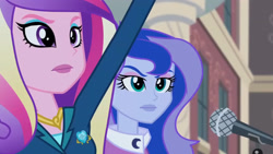 Size: 3072x1727 | Tagged: safe, screencap, dean cadance, princess cadance, princess luna, vice principal luna, human, equestria girls, g4, my little pony equestria girls: friendship games, canterlot high, duo, duo female, female, frown, microphone