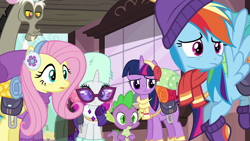 Size: 1280x720 | Tagged: safe, screencap, discord, fluttershy, rainbow dash, rarity, spike, twilight sparkle, alicorn, draconequus, dragon, pony, dungeons and discords, g4, season 6, clothes, earmuffs, fluttershy's purple sweater, reaction image, scarf, sunglasses, train station, twilight sparkle (alicorn), unamused, winter outfit