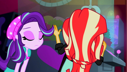Size: 3072x1727 | Tagged: safe, screencap, starlight glimmer, sunset shimmer, human, equestria girls, equestria girls specials, g4, my little pony equestria girls: mirror magic, beanie, canterlot mall, cinema, clothes, duo, duo female, eyes closed, female, frown, hat, jacket, leather, leather jacket