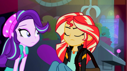 Size: 3072x1727 | Tagged: safe, screencap, starlight glimmer, sunset shimmer, human, equestria girls, equestria girls specials, g4, my little pony equestria girls: mirror magic, beanie, canterlot mall, cinema, clothes, duo, duo female, eyes closed, female, frown, geode of empathy, hat, jacket, jewelry, leather, leather jacket, magical geodes, necklace
