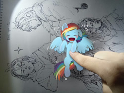 Size: 1032x774 | Tagged: safe, artist:marychristine08, rainbow dash, human, pegasus, pony, g4, bellyrubs, cute, dashabetes, hand, irl, irl human, laughing, lying down, photo, ponies in real life, solo, tickling, tiny, tiny ponies