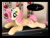 Size: 670x504 | Tagged: safe, artist:purplenebulastudios, fluttershy, pegasus, pony, g4, cute, female, flower, flower in hair, folded wings, irl, logo, lying down, mare, photo, plushie, pony plushie, prone, real life background, shyabetes, smiling, solo, sploot, wings