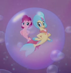 Size: 644x662 | Tagged: safe, screencap, pinkie pie, princess skystar, earth pony, seapony (g4), g4, my little pony: the movie, aquastria, bubble, cute, diapinkes, dorsal fin, female, fin, fin wings, fins, fish tail, flower, flower in hair, flowing mane, flowing tail, in bubble, jewelry, looking at each other, looking at someone, mare, necklace, needs more jpeg, ocean, open mouth, open smile, pearl necklace, pink background, scales, seaponified, seapony pinkie pie, seaquestria, seashell necklace, simple background, smiling, smiling at each other, species swap, swimming, tail, underwater, water, wings