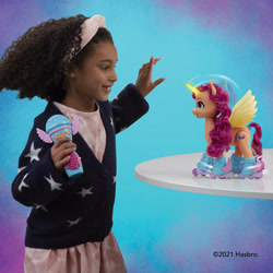 Size: 3000x3000 | Tagged: safe, sunny starscout, alicorn, human, pony, g5, female, hasbro, high res, irl, irl human, microphone, photo, remote control, roller skates, skates, target demographic, toy, walmart